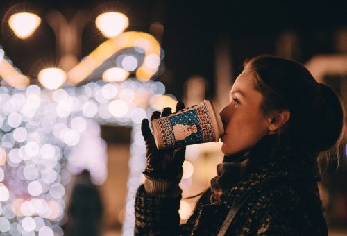 Lady drinking coffee at winter event