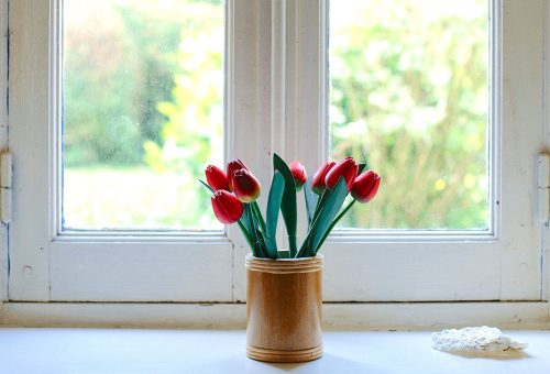 Vase of flowers on window sill