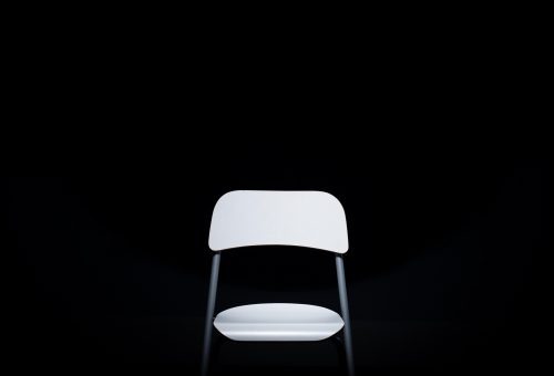 White chair on black background