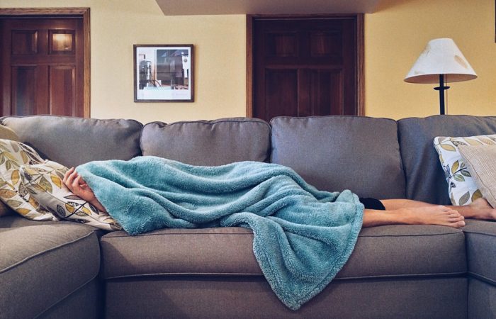 Person sleeping on sofa