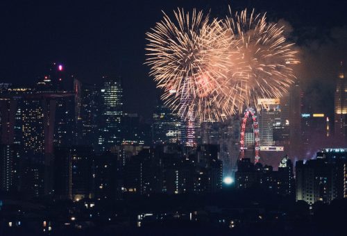 Fireworks exploding over city